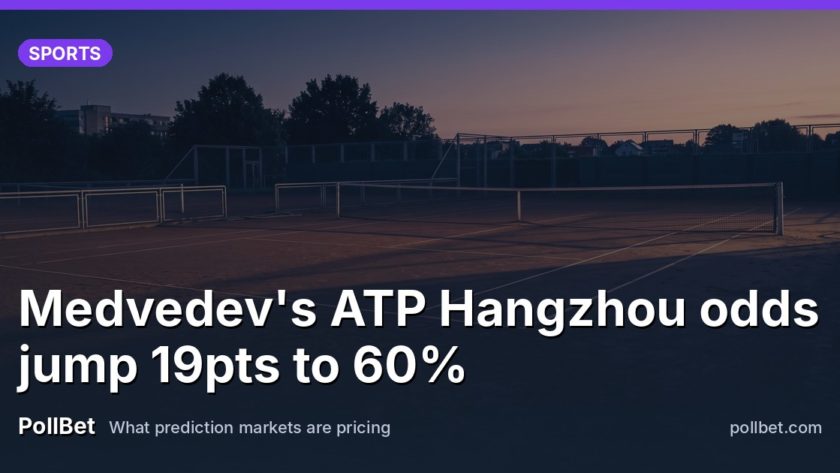An empty outdoor tennis court at dawn with long shadows across the clay.